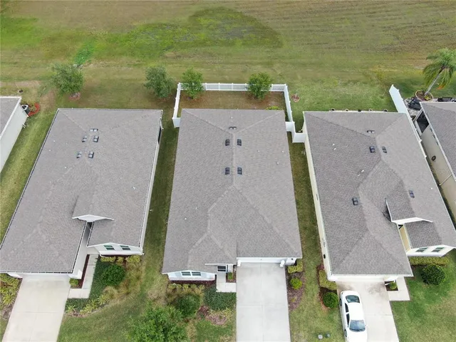 an aerial view of a house with a ocean view