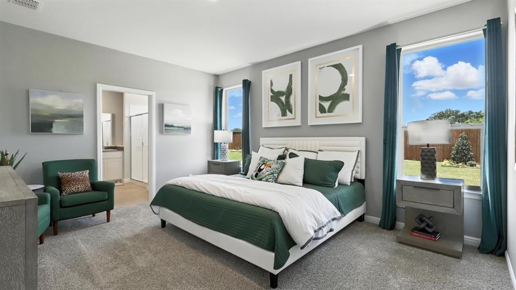 657 Harvey Street Grandview, TX 76050 - Photo 15 of 40 a bedroom with a bed couch painting on the wall and a window