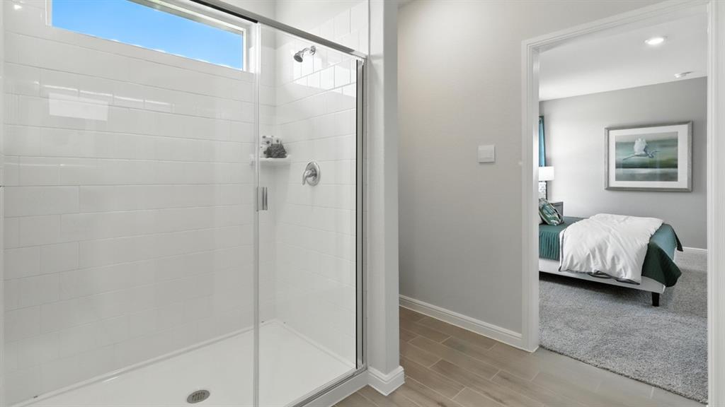 657 Harvey Street Grandview, TX 76050 - Photo 20 of 40 a bathroom with a white tub shower and vanity