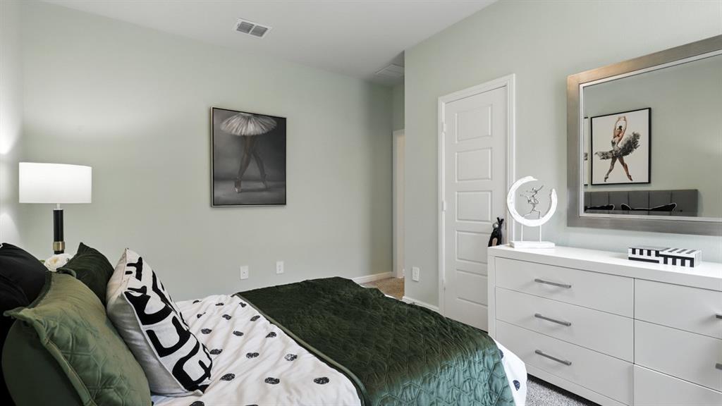 657 Harvey Street Grandview, TX 76050 - Photo 29 of 40 a bedroom with a bed and a night stand