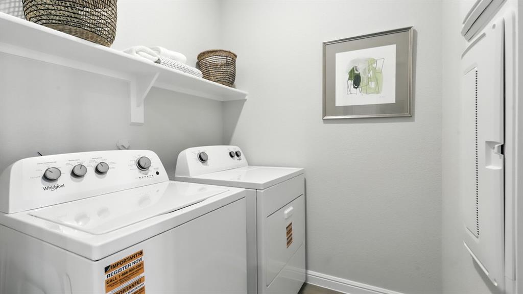 657 Harvey Street Grandview, TX 76050 - Photo 35 of 40 a utility room with dryer and washer
