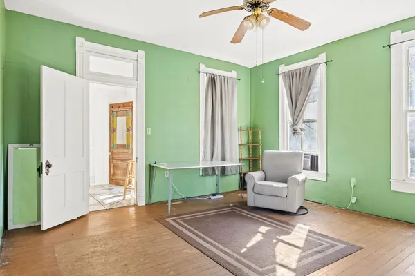 a living room with furniture and a window