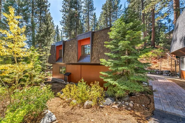 a view of a house with a tree