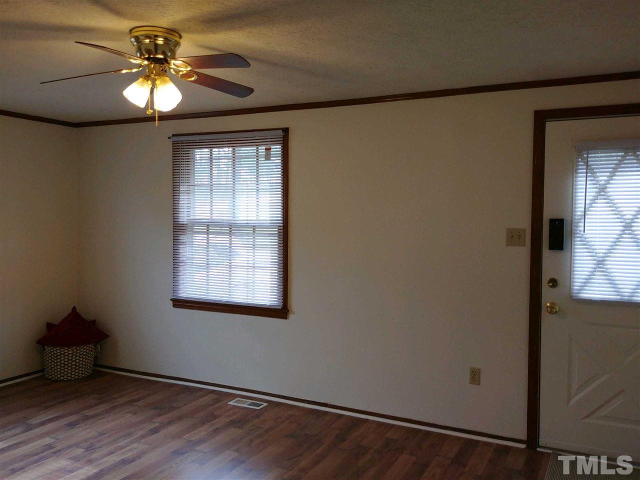 2312 Creech Road Raleigh, NC 27610 - Photo 4 of 11 a window in an empty room