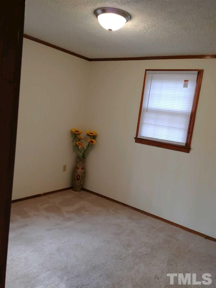 2312 Creech Road Raleigh, NC 27610 - Photo 8 of 11 a view of a hallway with a window