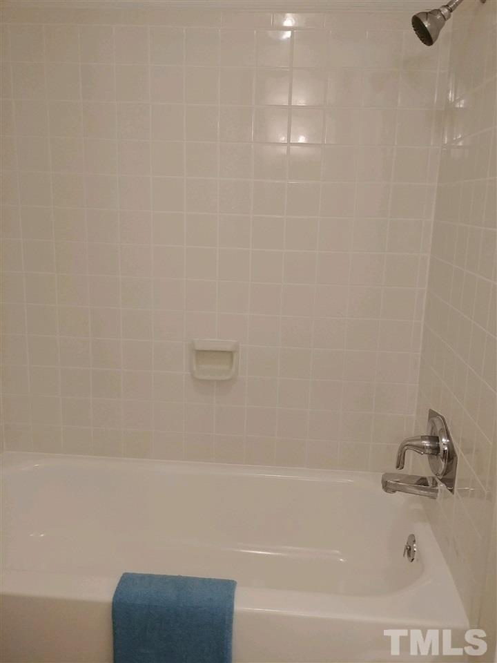 2312 Creech Road Raleigh, NC 27610 - Photo 10 of 11 a bathroom with a bathtub