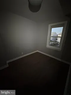 a view of wooden floor in an empty room