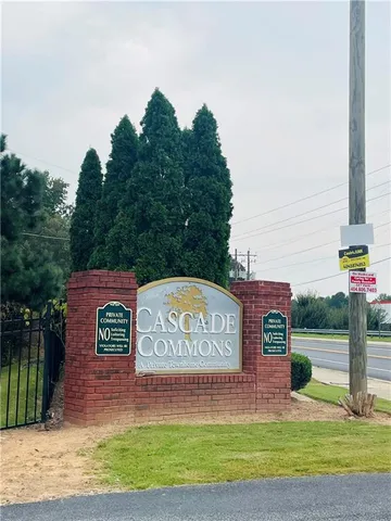 a view of a street with red sign board