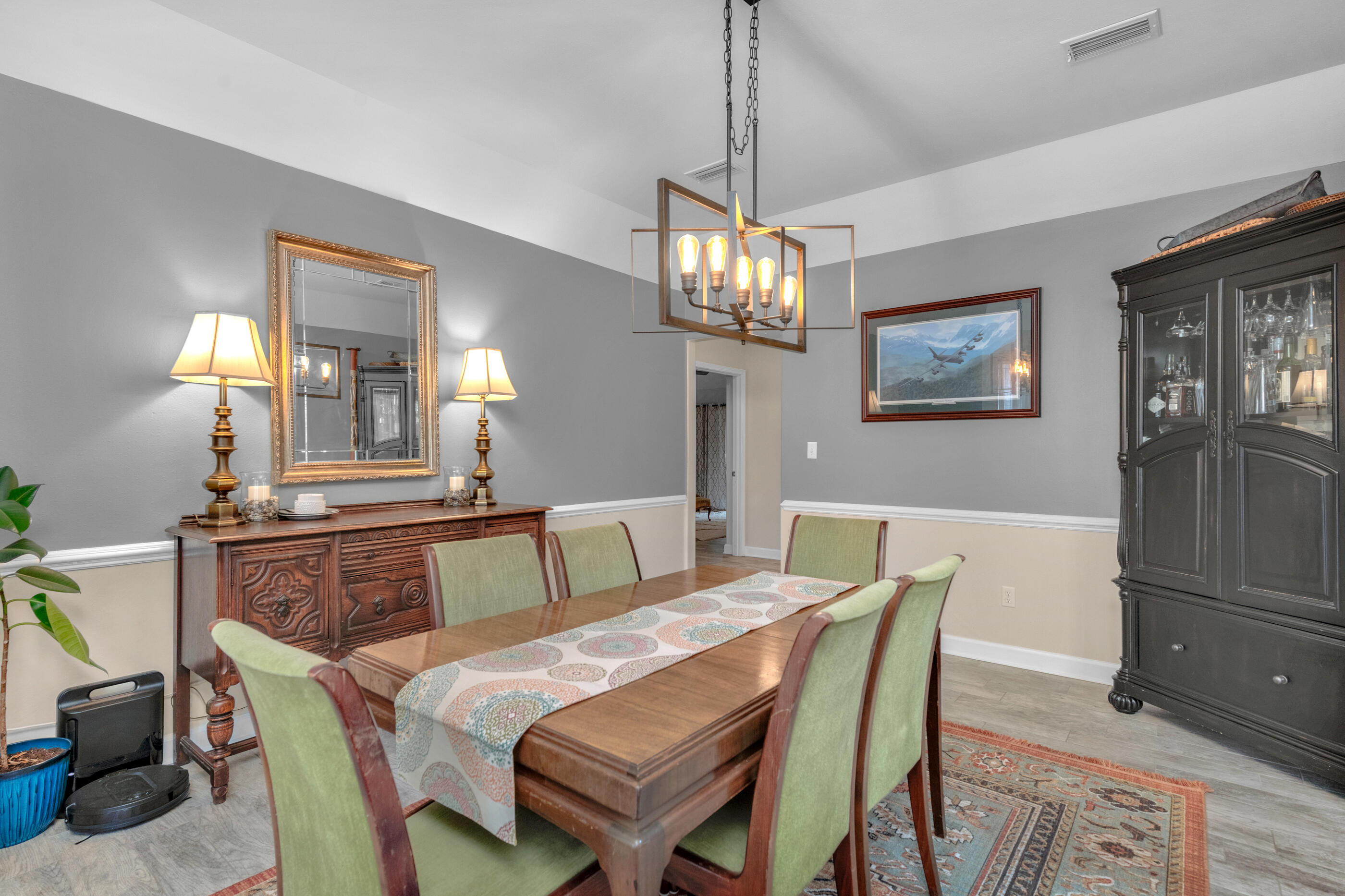 4475 Woodbridge Road Niceville, FL 32578 - Photo 20 of 49 a view of a dining room with furniture and chandelier