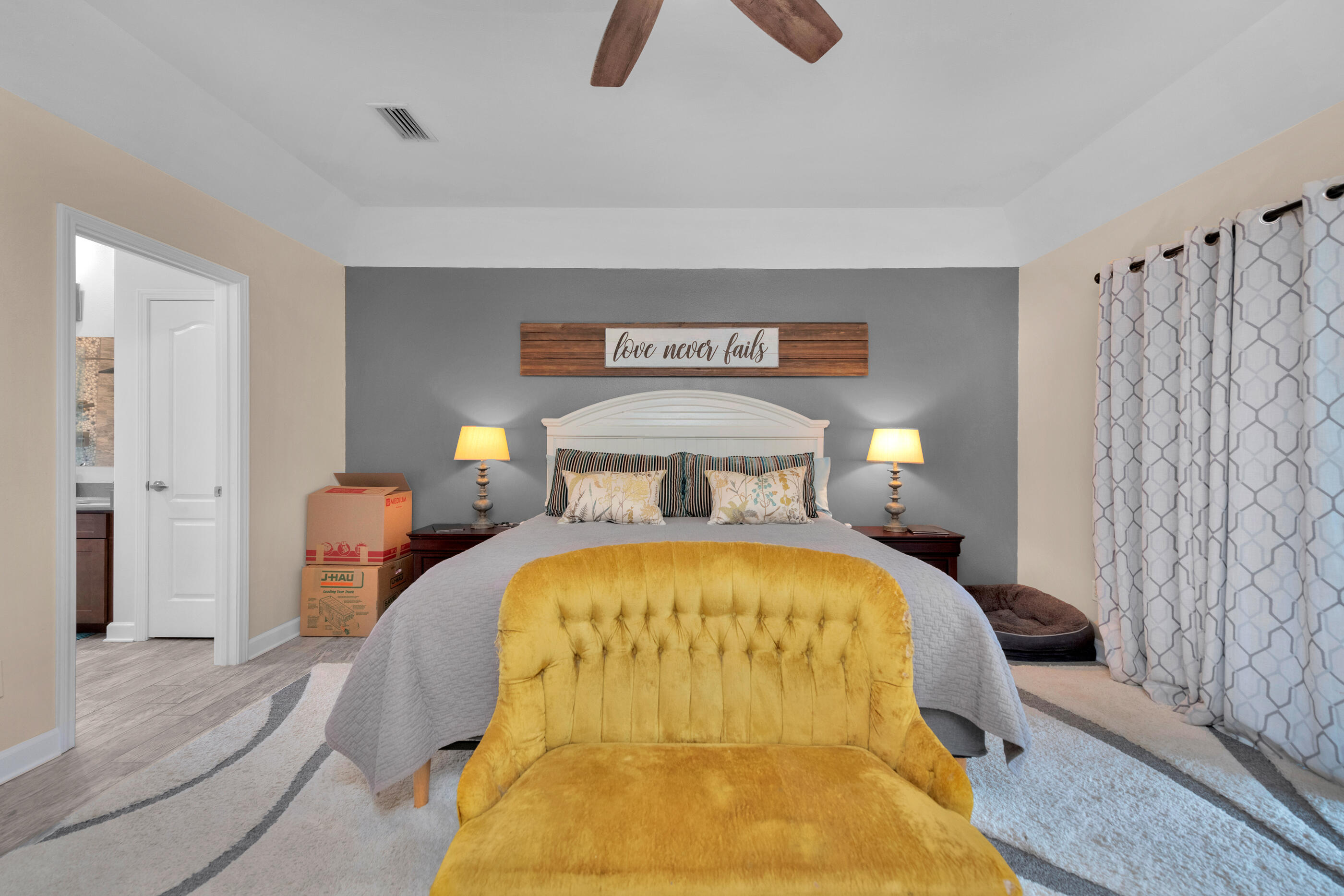4475 Woodbridge Road Niceville, FL 32578 - Photo 22 of 49 a bedroom with a bed and a chandelier