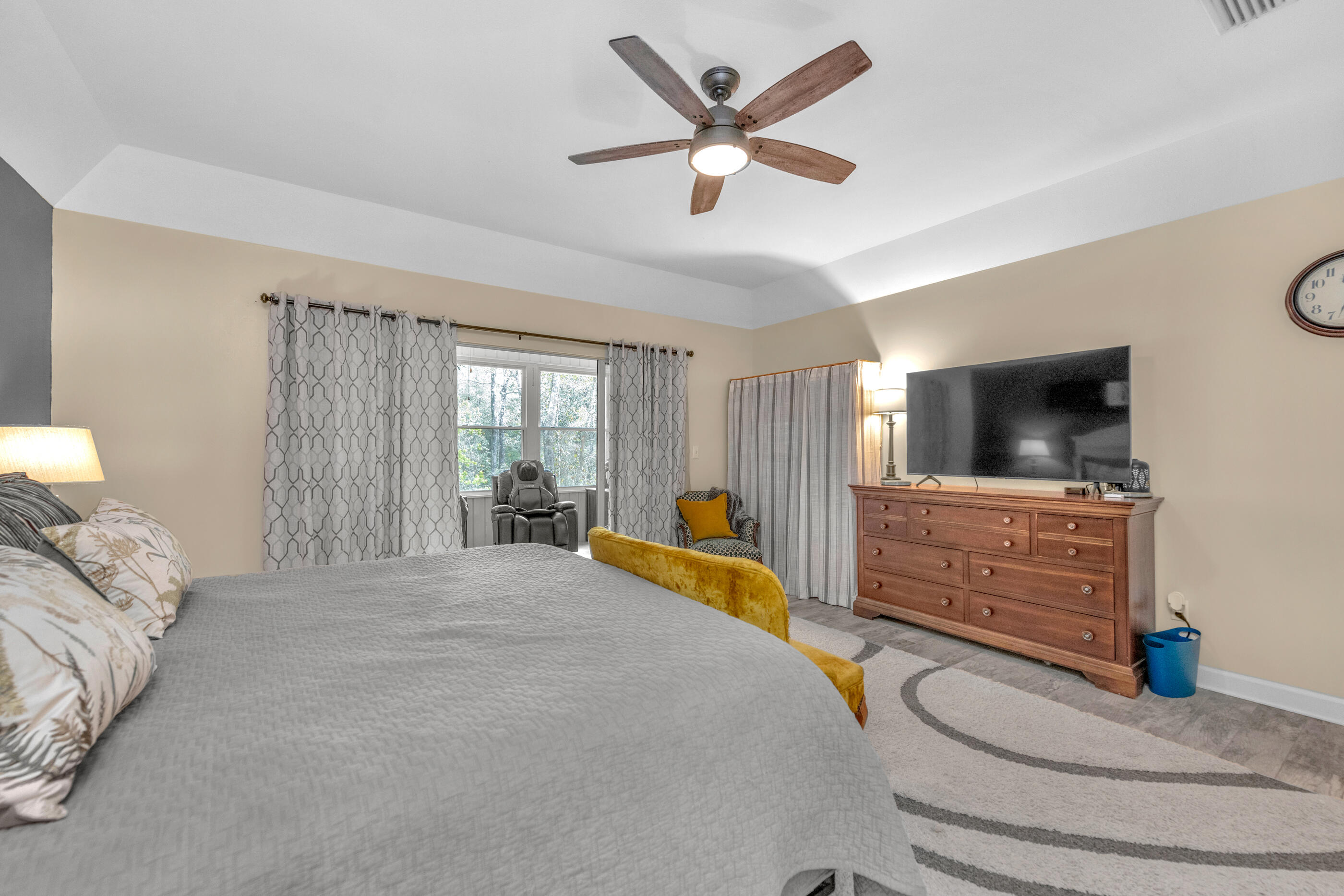 4475 Woodbridge Road Niceville, FL 32578 - Photo 23 of 49 a bed room with a bed a television and dresser