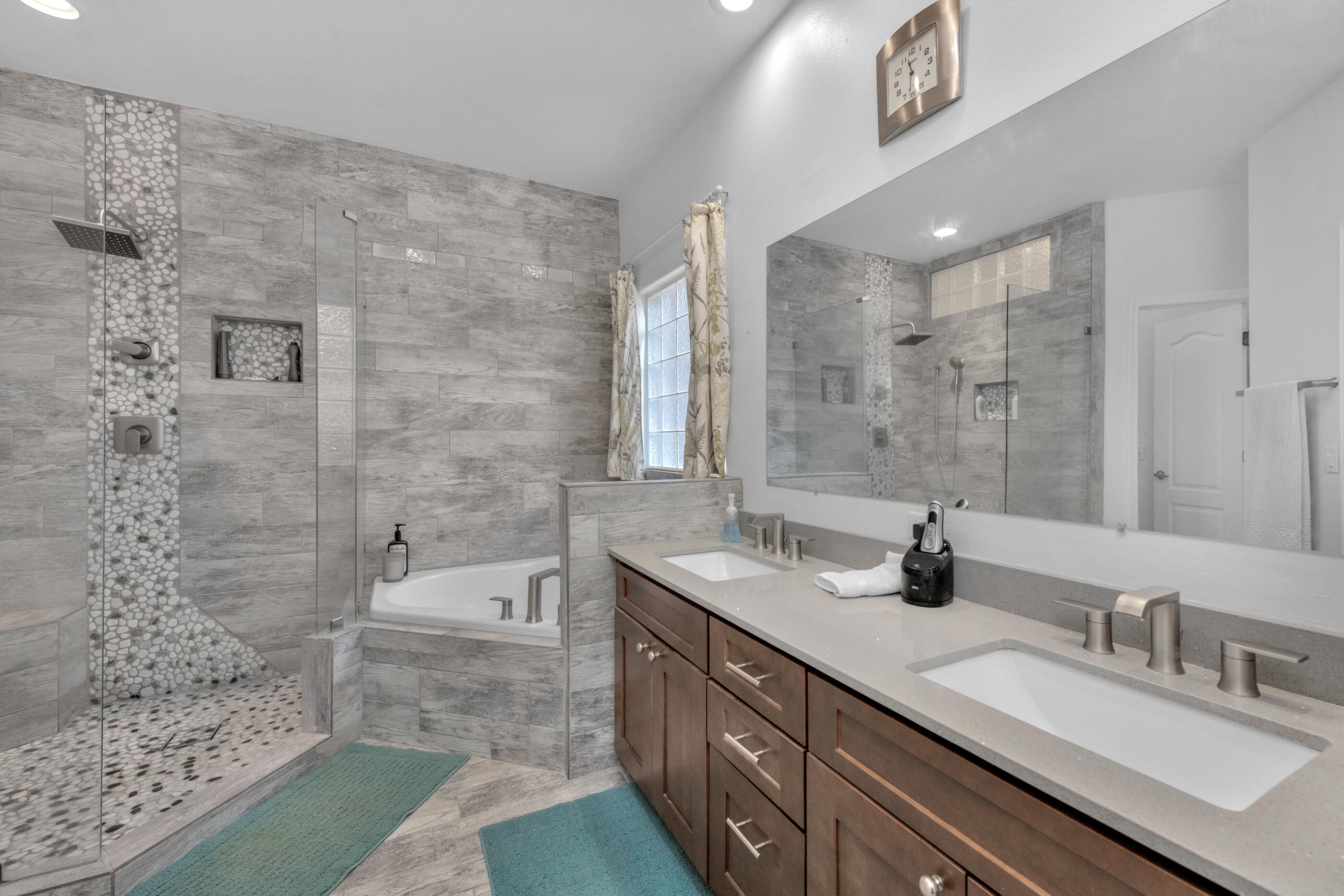 4475 Woodbridge Road Niceville, FL 32578 - Photo 24 of 49 a bathroom with a double vanity sink and a mirror
