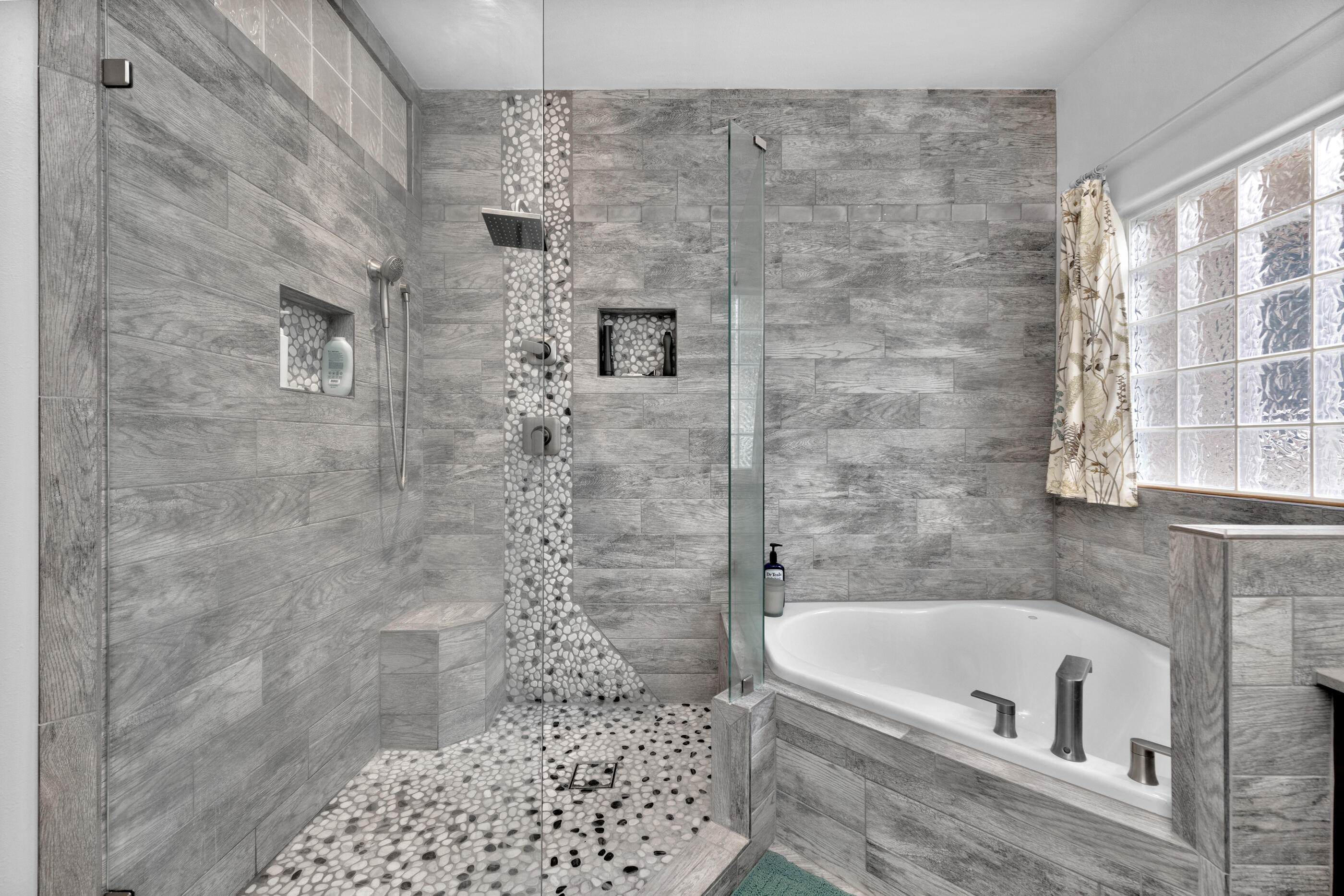4475 Woodbridge Road Niceville, FL 32578 - Photo 25 of 49 a bathroom with a bathtub and a shower