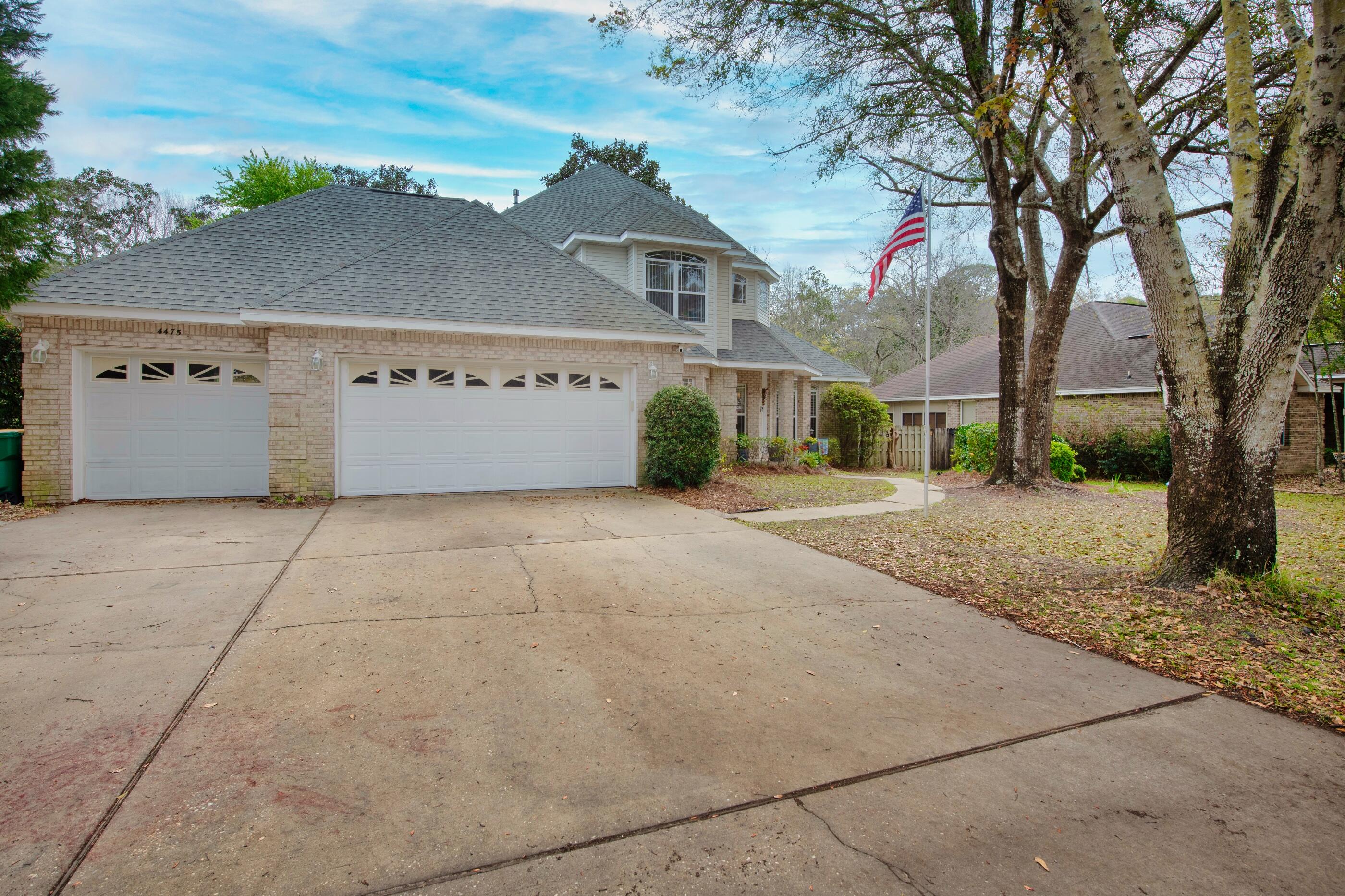 4475 Woodbridge Road Niceville, FL 32578 - Photo 4 of 49 front view of a house with a street