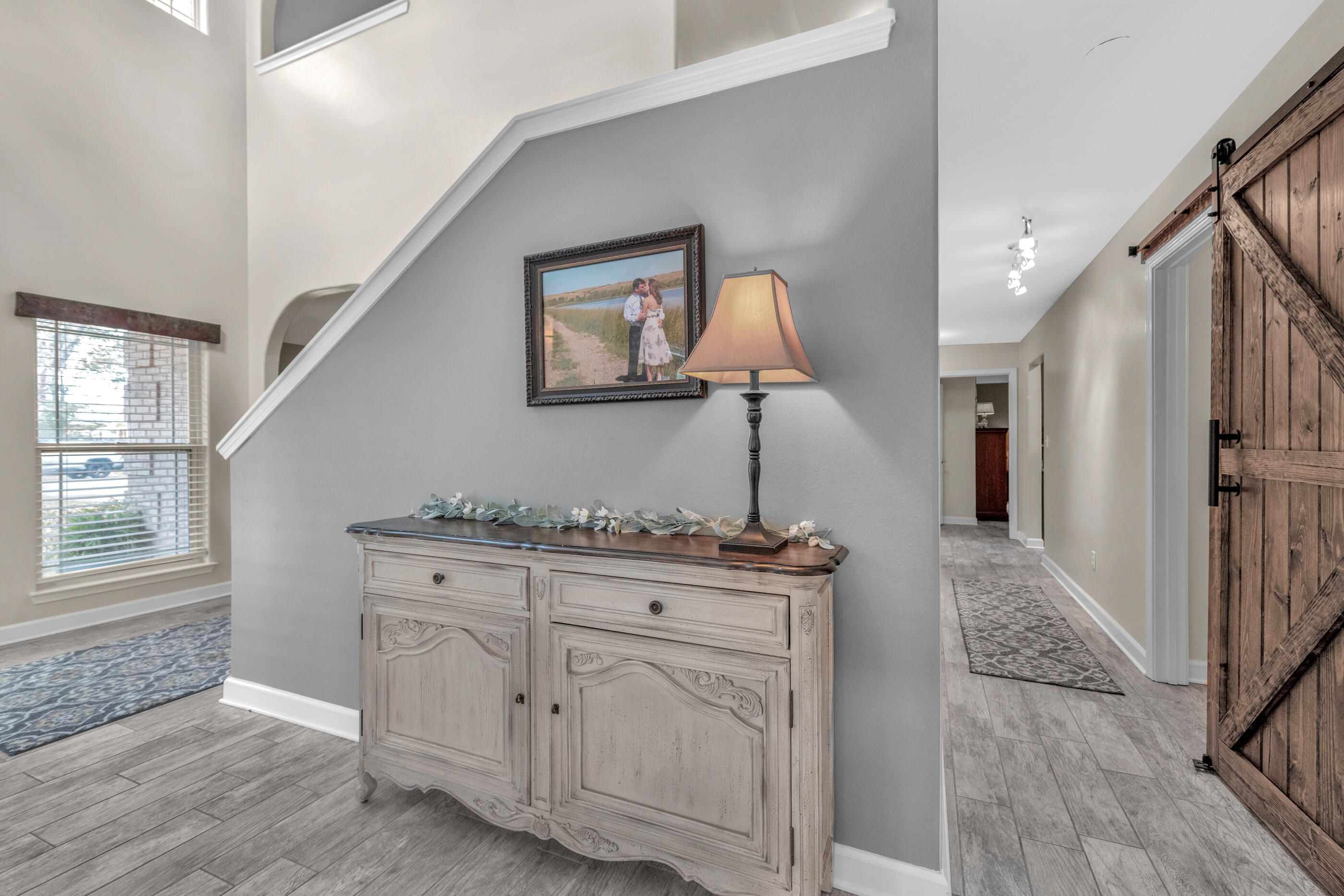 4475 Woodbridge Road Niceville, FL 32578 - Photo 5 of 49 a hallway with cabinets
