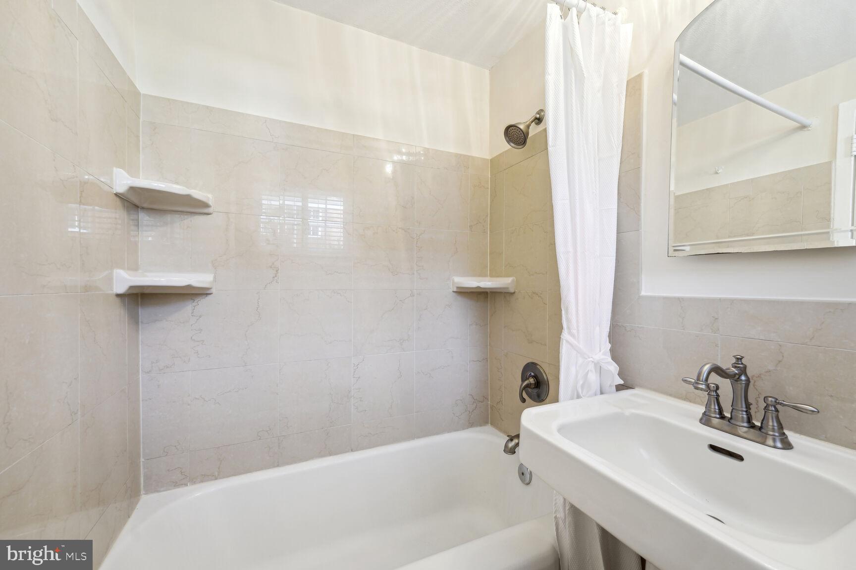 3708 Gunston Road Alexandria, VA 22302 - Photo 13 of 29 Marble tiled bathroom