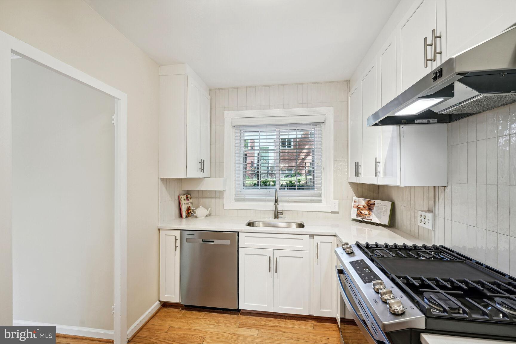 3708 Gunston Road Alexandria, VA 22302 - Photo 3 of 29 Quartz counters with custom tile backsplash