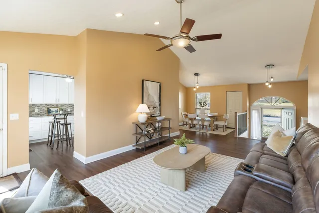 a view of a dining room with furniture and wooden floor