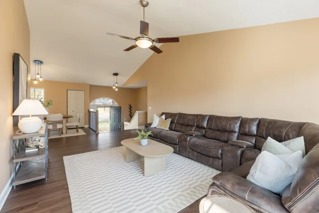 a kitchen with a sink cabinets stainless steel appliances and a window