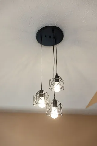 a large kitchen with a stove and a refrigerator