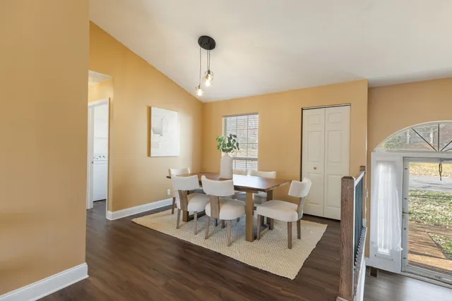 a kitchen with stainless steel appliances a stove a microwave and sink