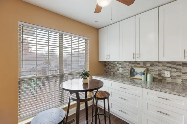 a bedroom with a bed and a lamp