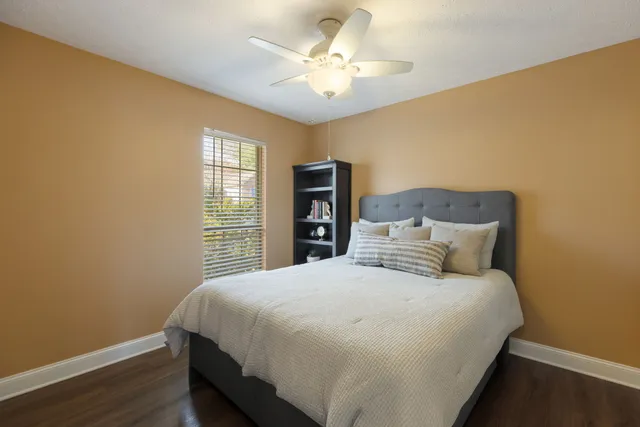 a view of swimming pool with a yard in front of it