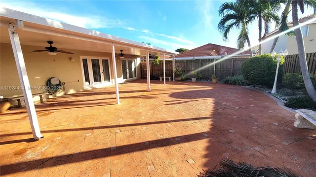 a view of a backyard with sitting area