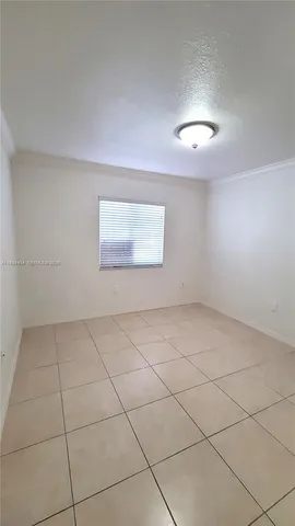 an empty room with a empty space and a window