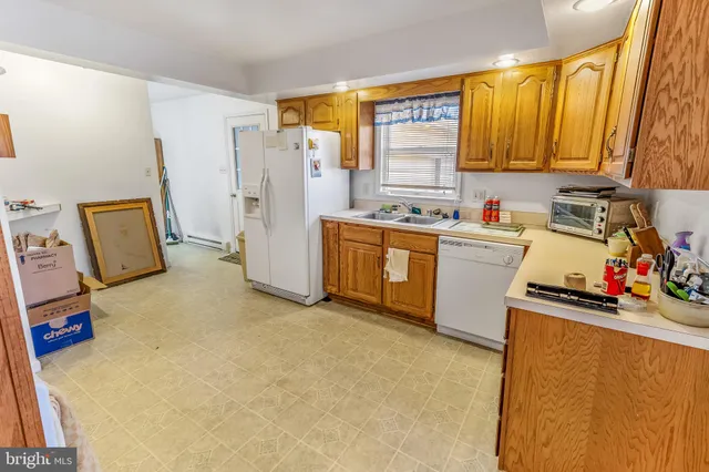 a view of a dining room with furniture and a window