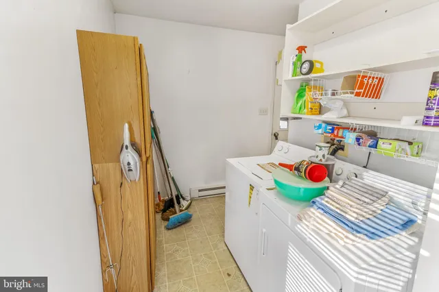 a bathroom with a sink toilet a mirror and shower