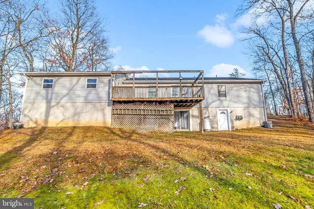 a backyard of a house with large trees
