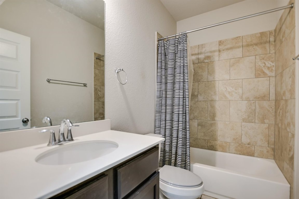 124 Ancellotta Way Leander, TX 78641 - Photo 15 of 20 Bathroom with vanity and shower / bath combo with shower curtain
