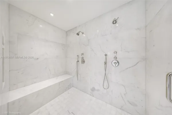 a view of an empty room with a white walls