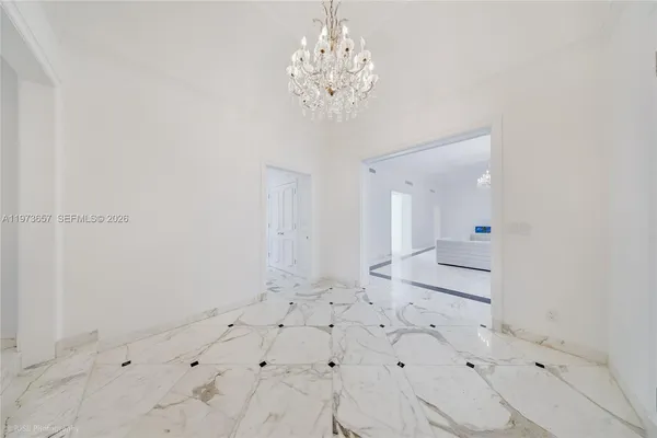 a view of a bathroom with a sink and a mirror