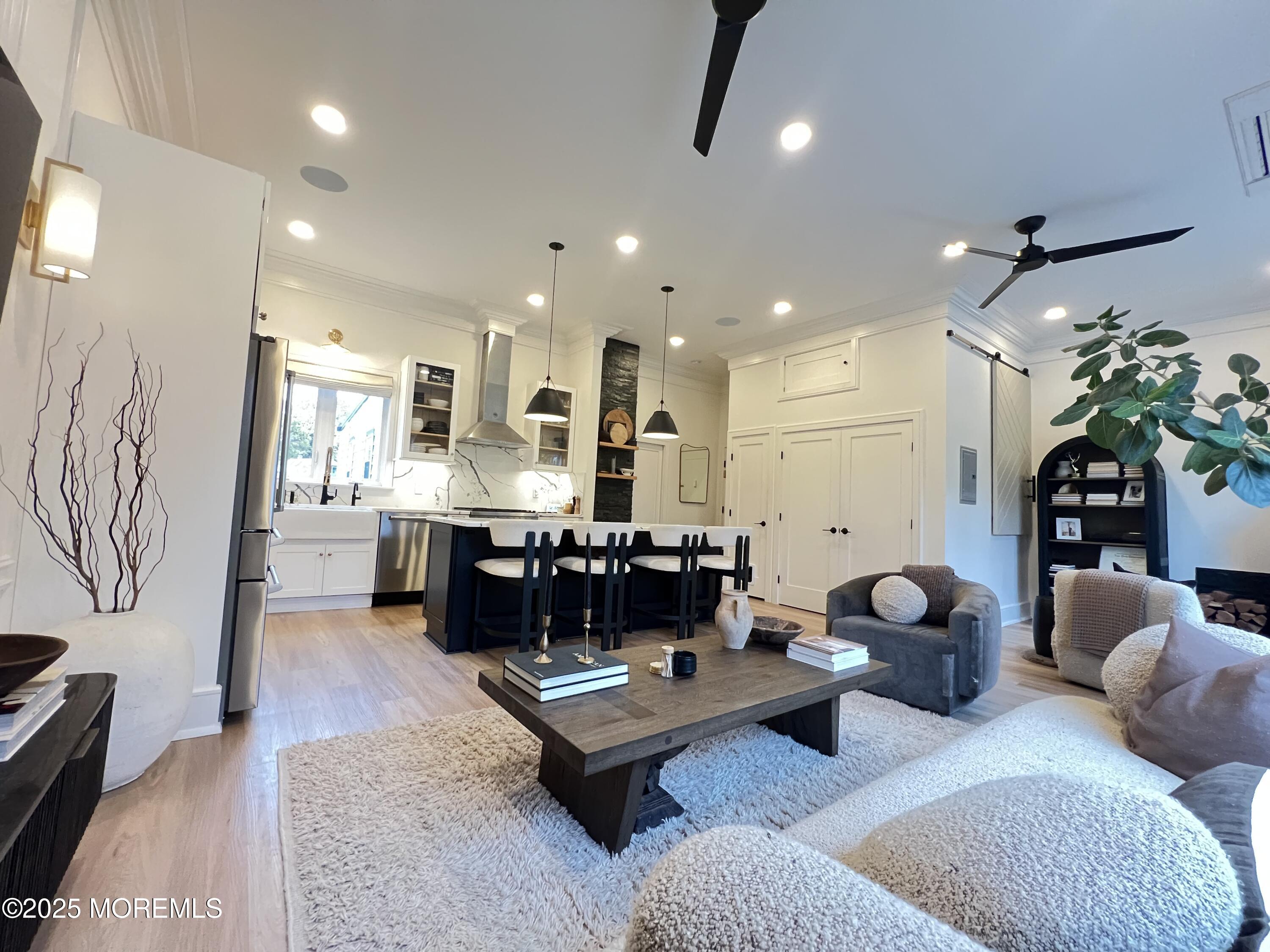164 Glenwood Avenue, Unit 201 Bloomfield, NJ 07003 - Photo 11 of 26 a living room with furniture kitchen view and a table