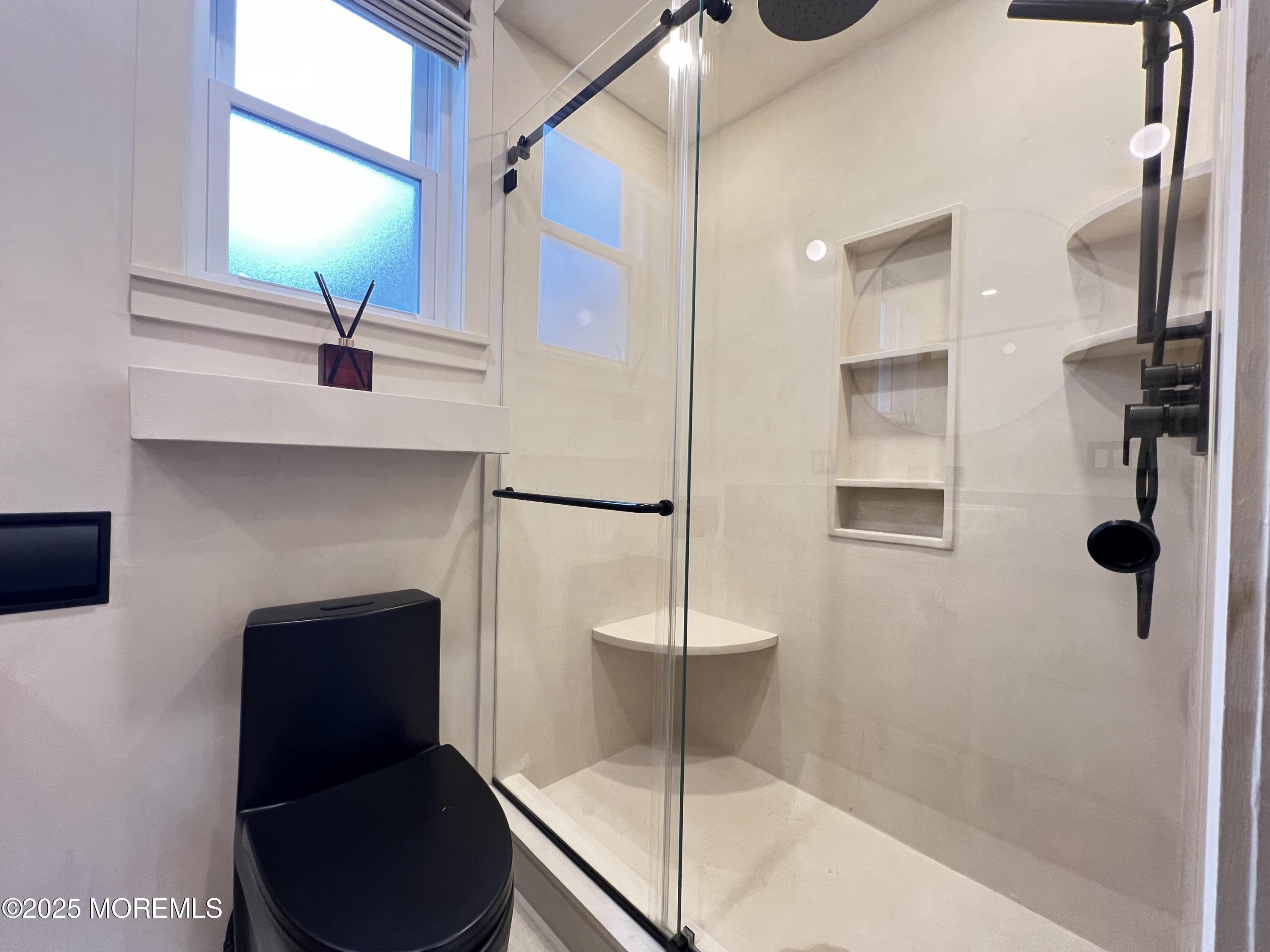 164 Glenwood Avenue, Unit 201 Bloomfield, NJ 07003 - Photo 17 of 26 a bathroom with a shower