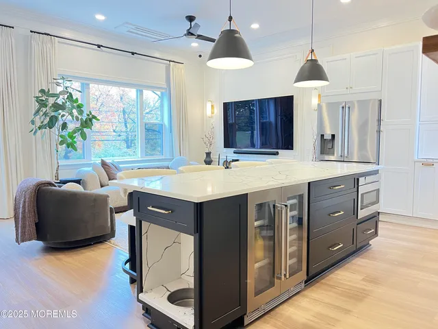 a kitchen with a stove a sink and a refrigerator