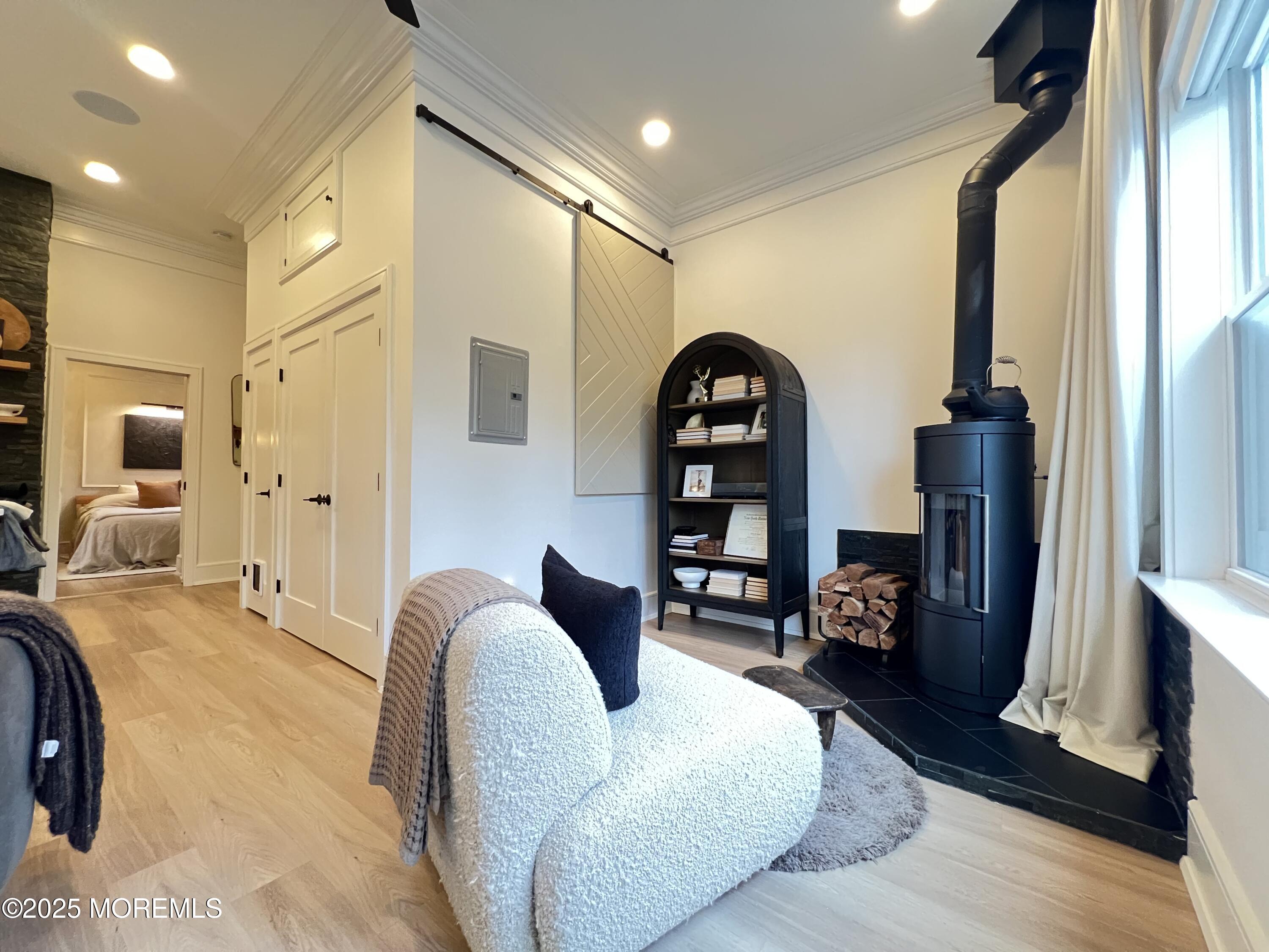 164 Glenwood Avenue, Unit 201 Bloomfield, NJ 07003 - Photo 21 of 26 a living room with furniture and a flat screen tv