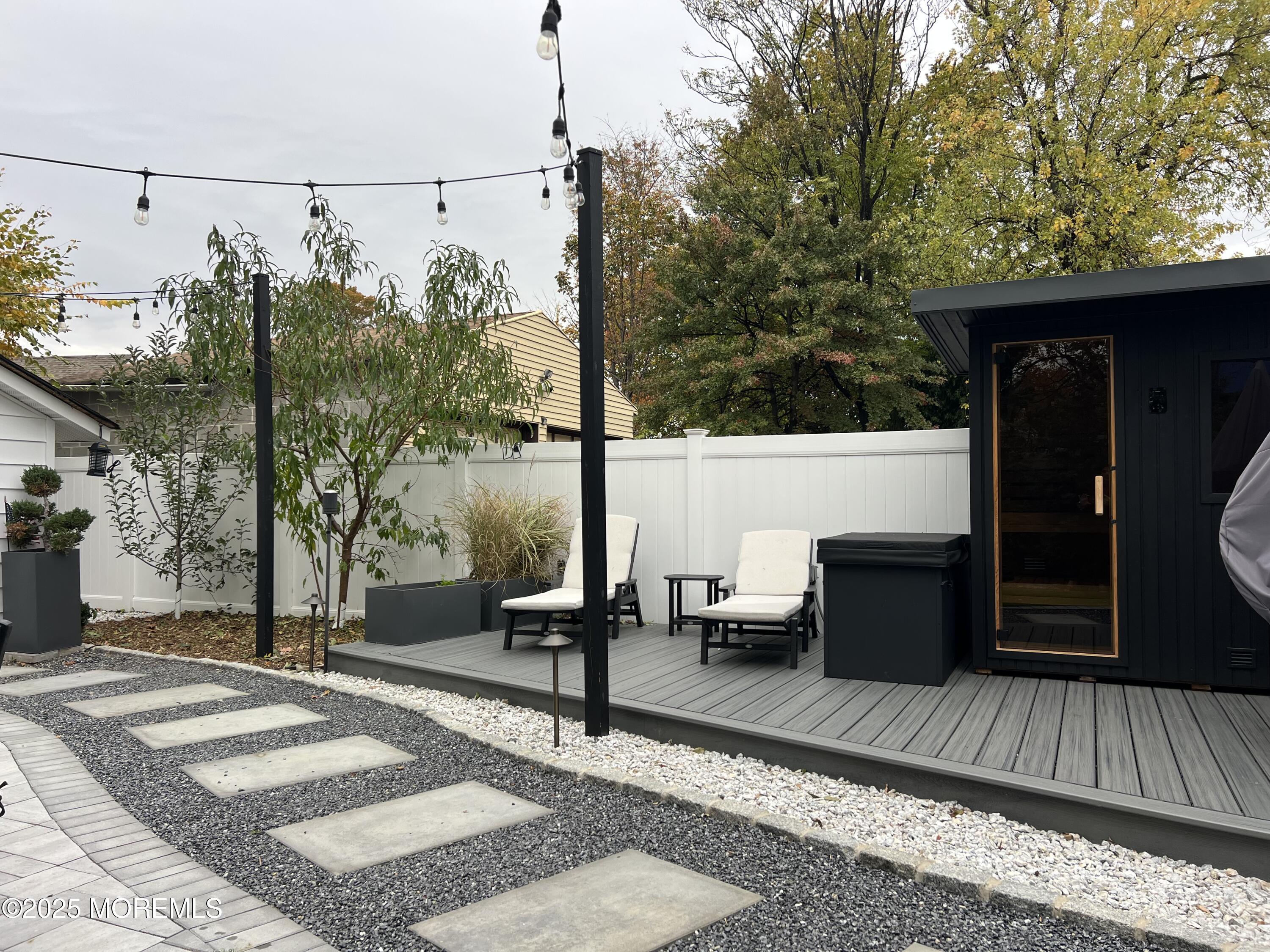 164 Glenwood Avenue, Unit 201 Bloomfield, NJ 07003 - Photo 26 of 26 a view of balcony with wooden floor and outdoor seating