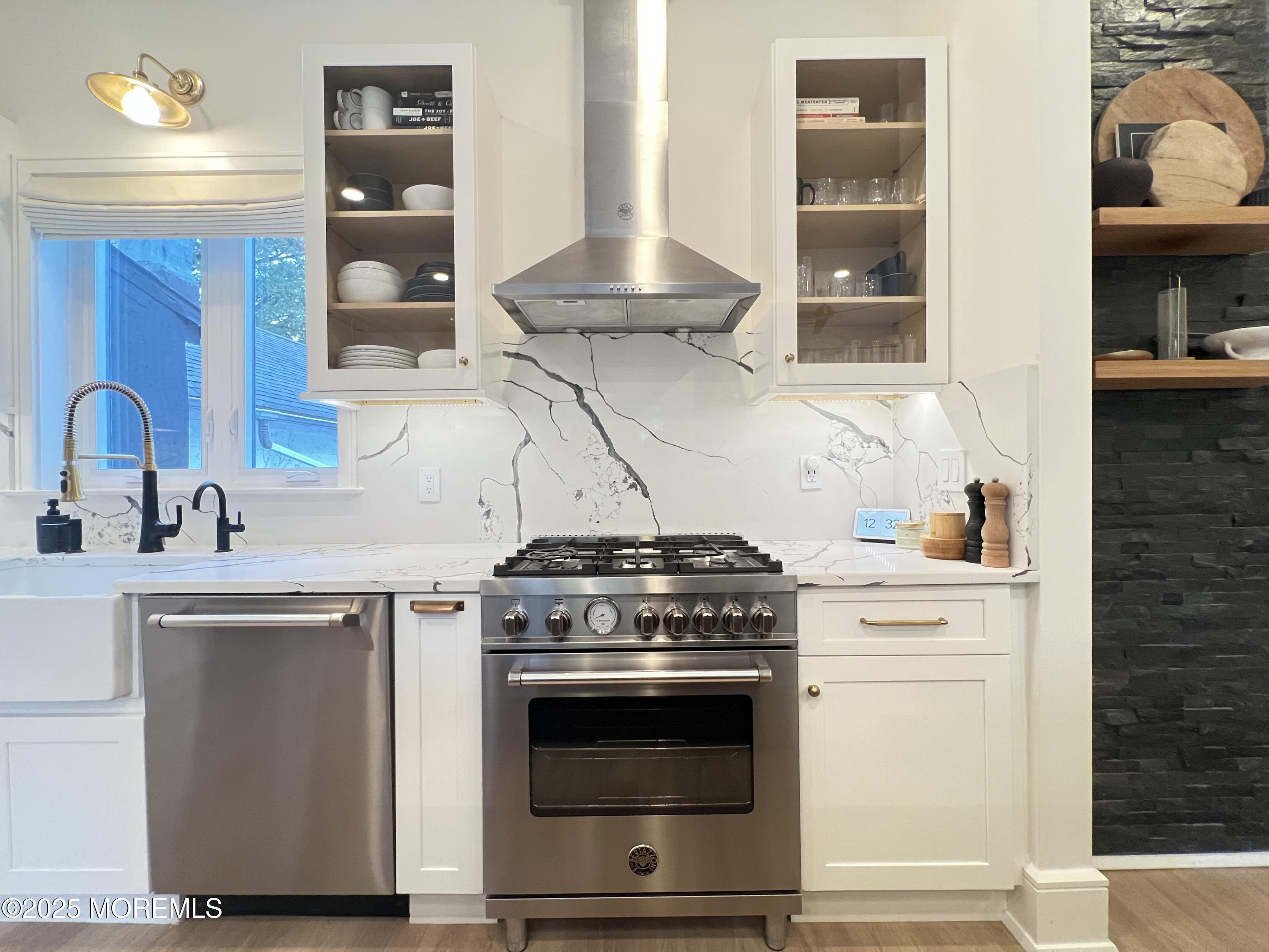 164 Glenwood Avenue, Unit 201 Bloomfield, NJ 07003 - Photo 3 of 26 a stove top oven sitting inside of a kitchen