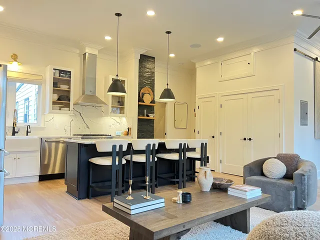a large kitchen with lots of counter space and furniture