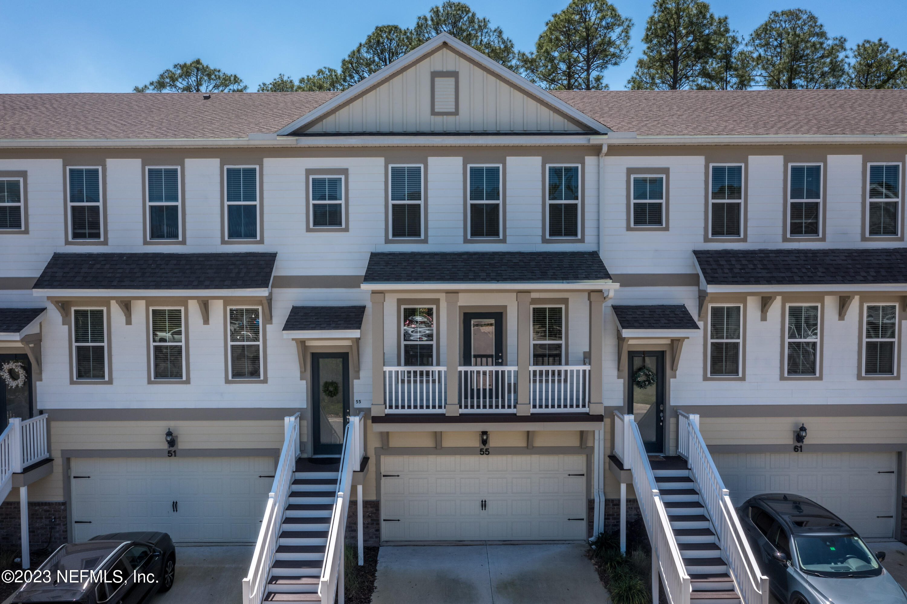 55 Spring Tide Way Ponte Vedra, FL 32081 - Photo 2 of 75 a front view of a building with many windows
