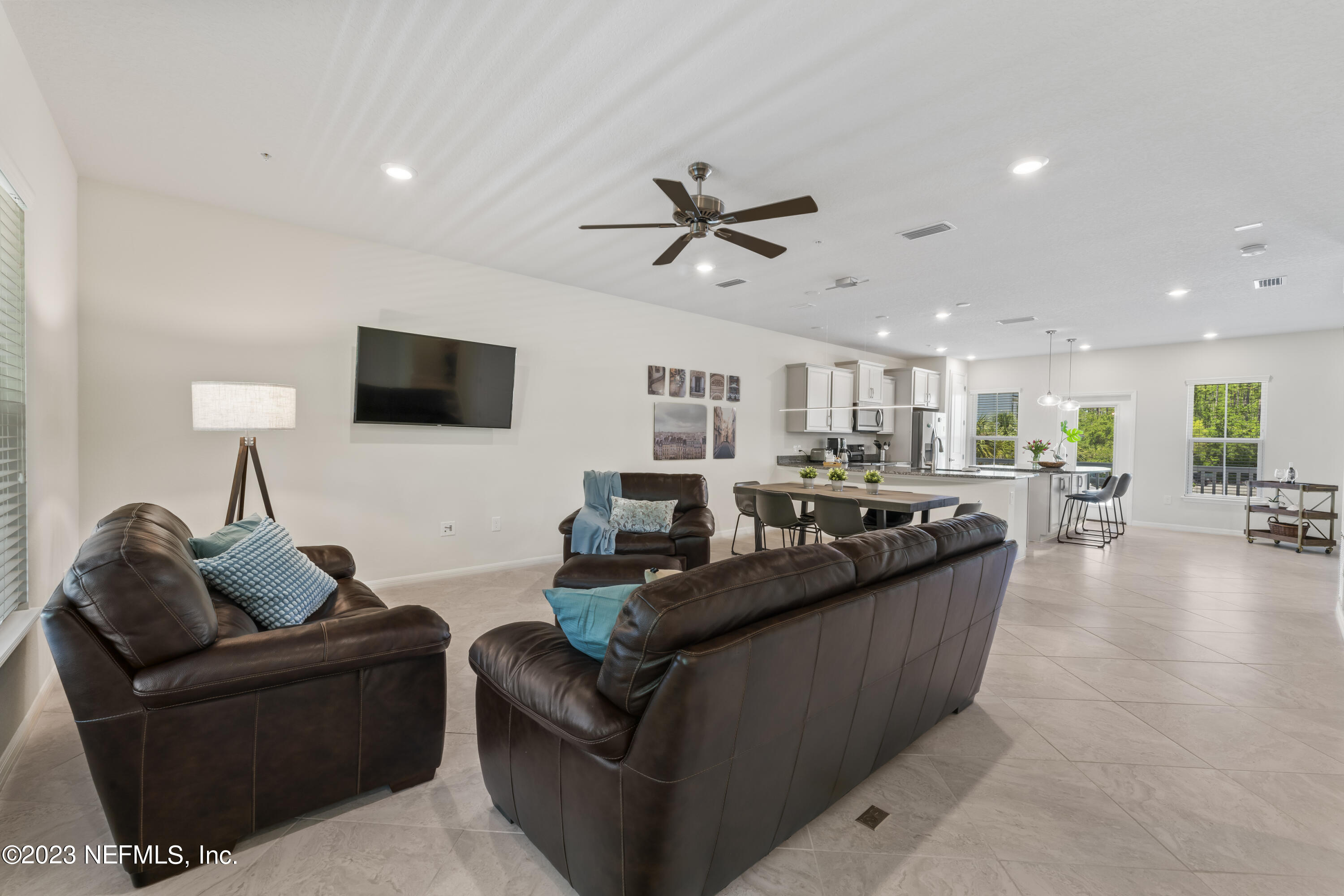 55 Spring Tide Way Ponte Vedra, FL 32081 - Photo 21 of 75 a living room with furniture and a flat screen tv