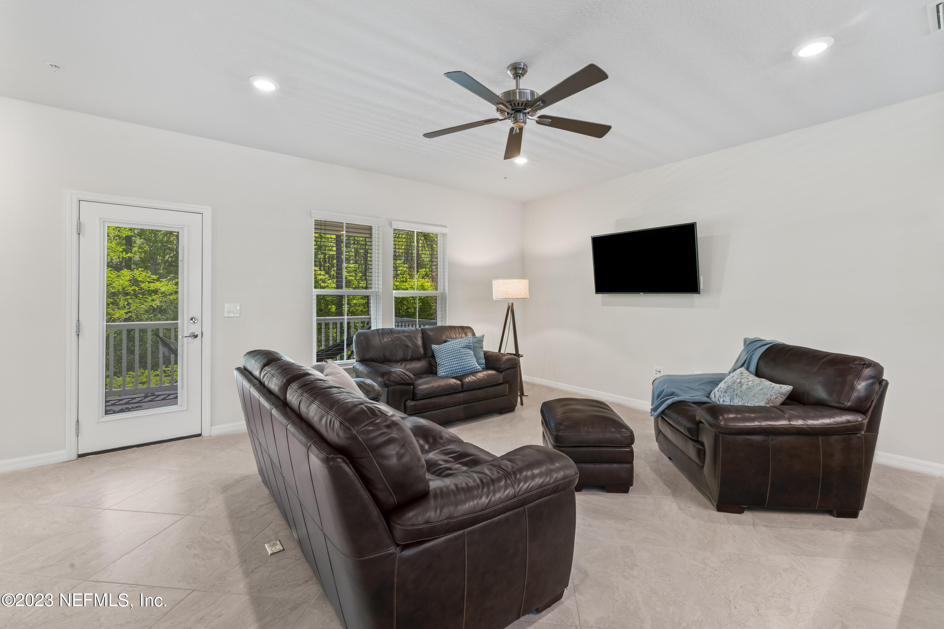 55 Spring Tide Way Ponte Vedra, FL 32081 - Photo 22 of 75 a living room with furniture and a flat screen tv