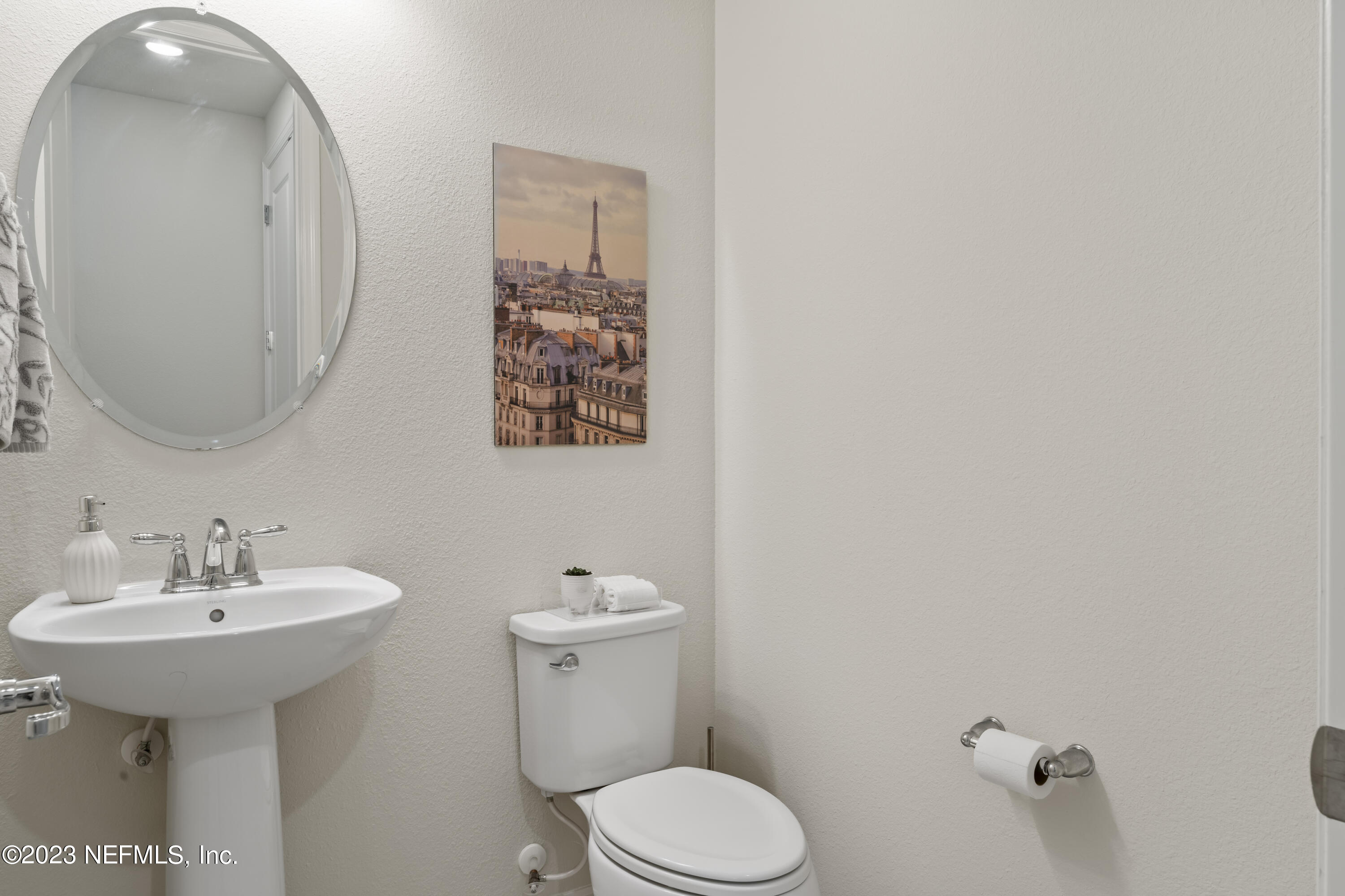 55 Spring Tide Way Ponte Vedra, FL 32081 - Photo 27 of 75 a bathroom with a toilet sink and mirror
