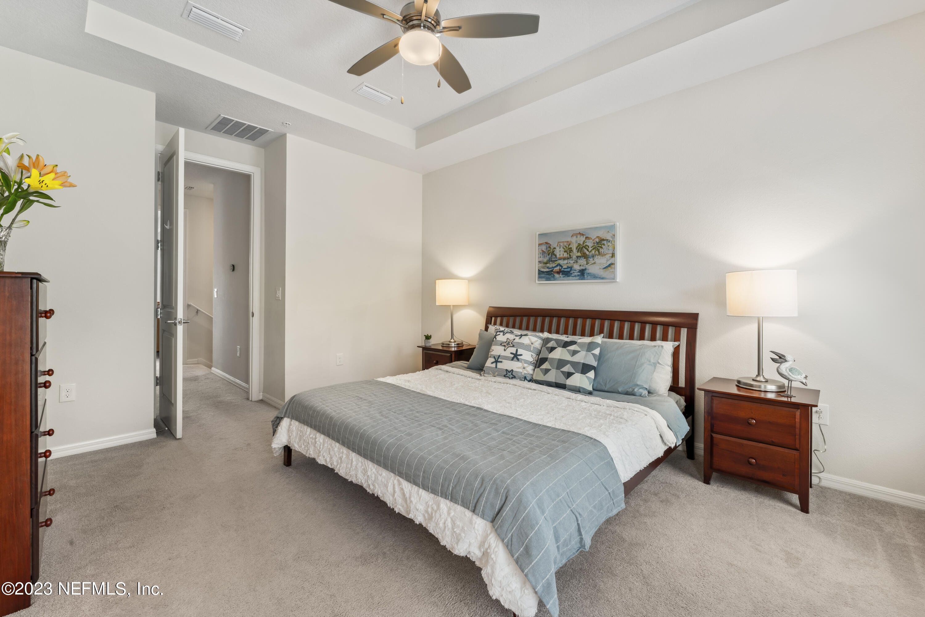 55 Spring Tide Way Ponte Vedra, FL 32081 - Photo 28 of 75 a bedroom with a bed and a ceiling fan