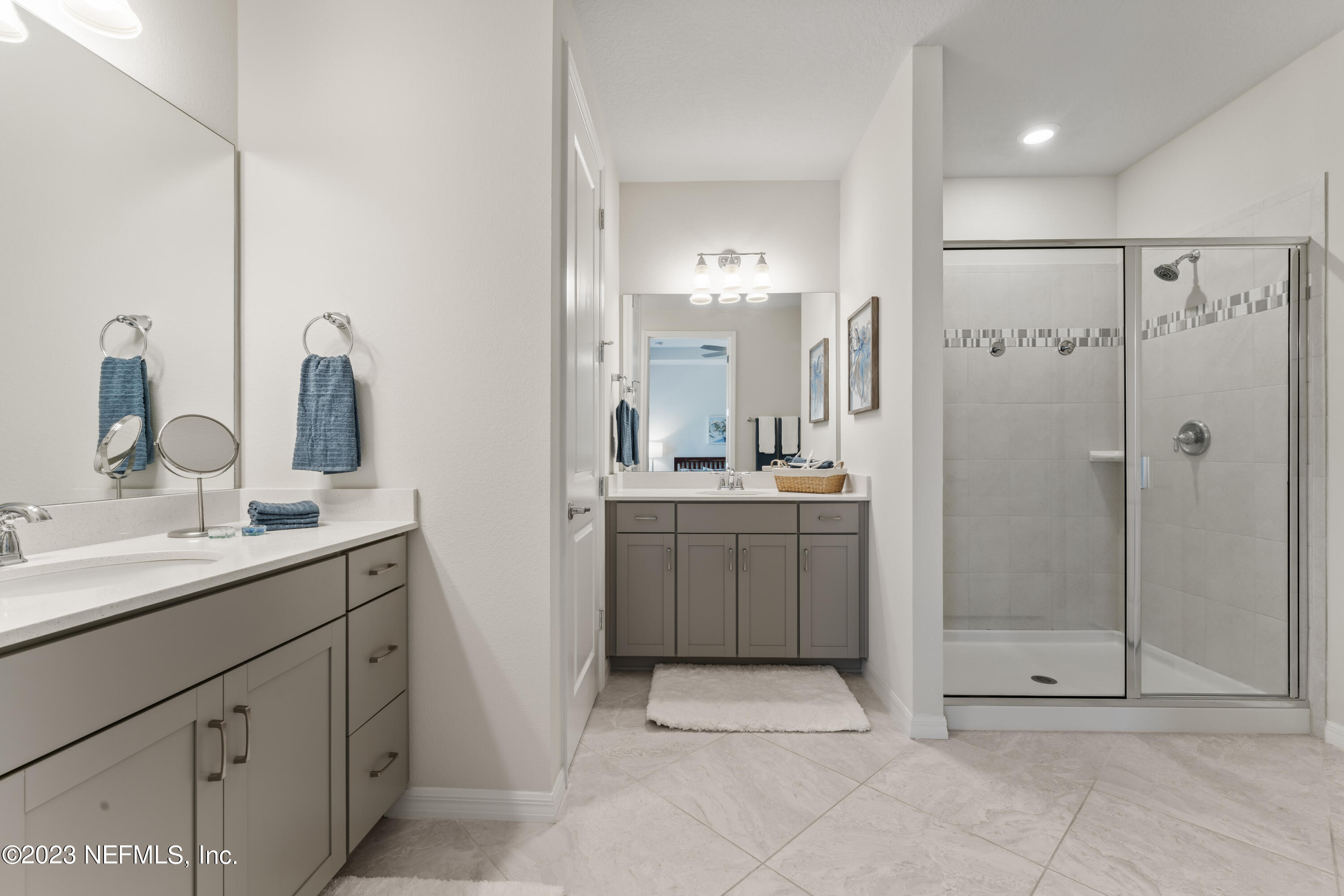 55 Spring Tide Way Ponte Vedra, FL 32081 - Photo 31 of 75 a bathroom with a double vanity sink mirror and shower