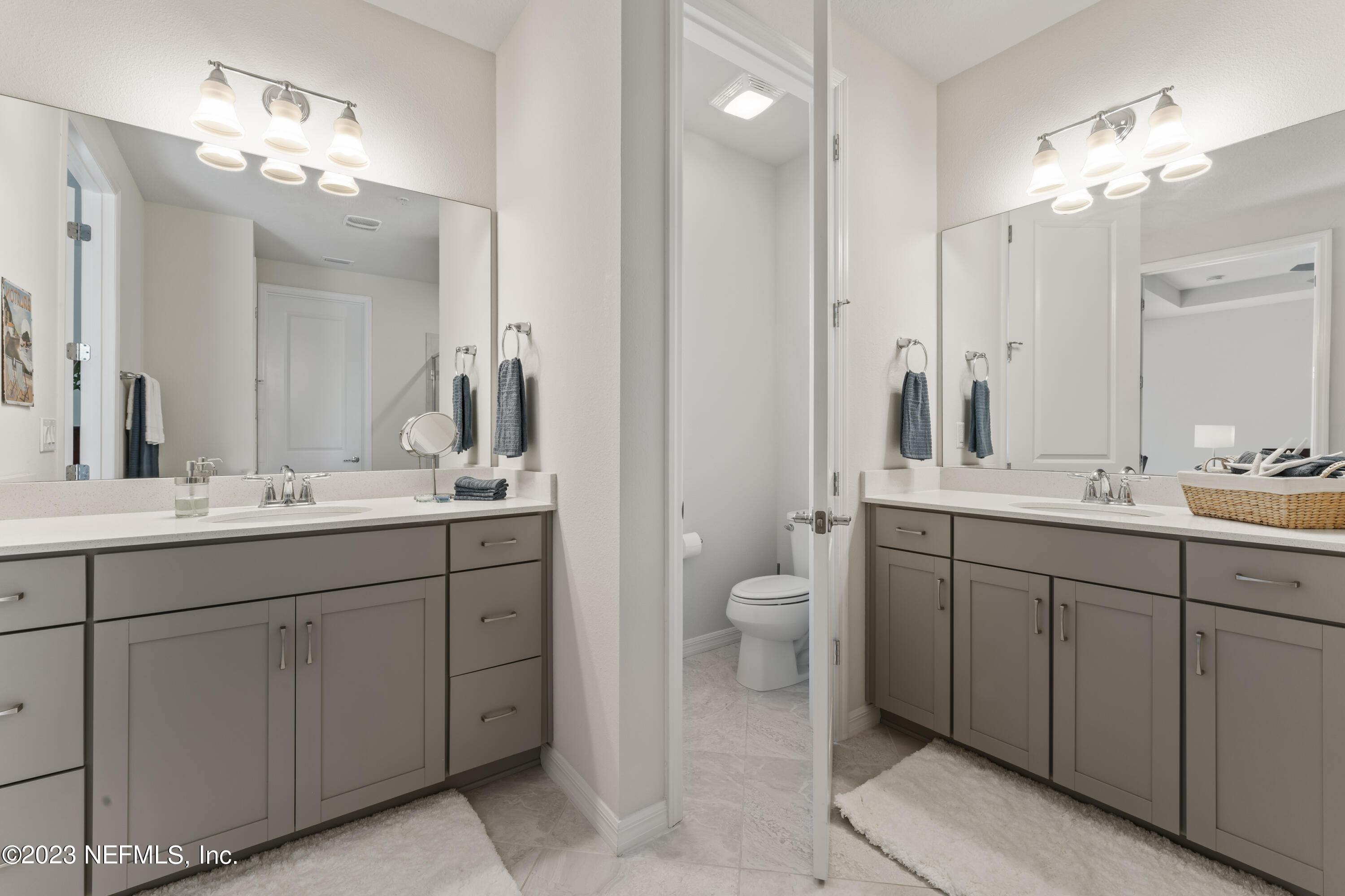 55 Spring Tide Way Ponte Vedra, FL 32081 - Photo 32 of 75 a bathroom with a sink double vanity and a mirror