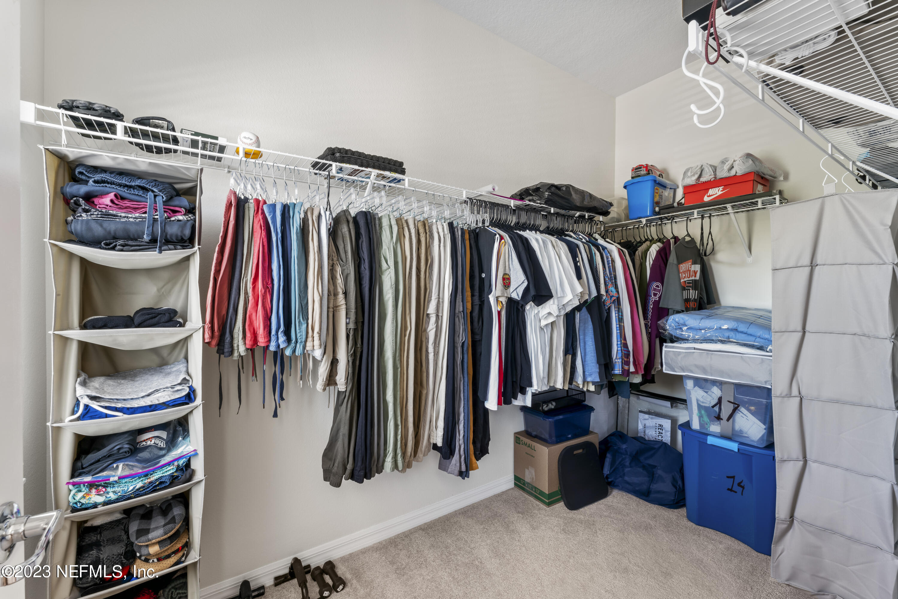 55 Spring Tide Way Ponte Vedra, FL 32081 - Photo 34 of 75 a view of walk in closet with clothes and shoes